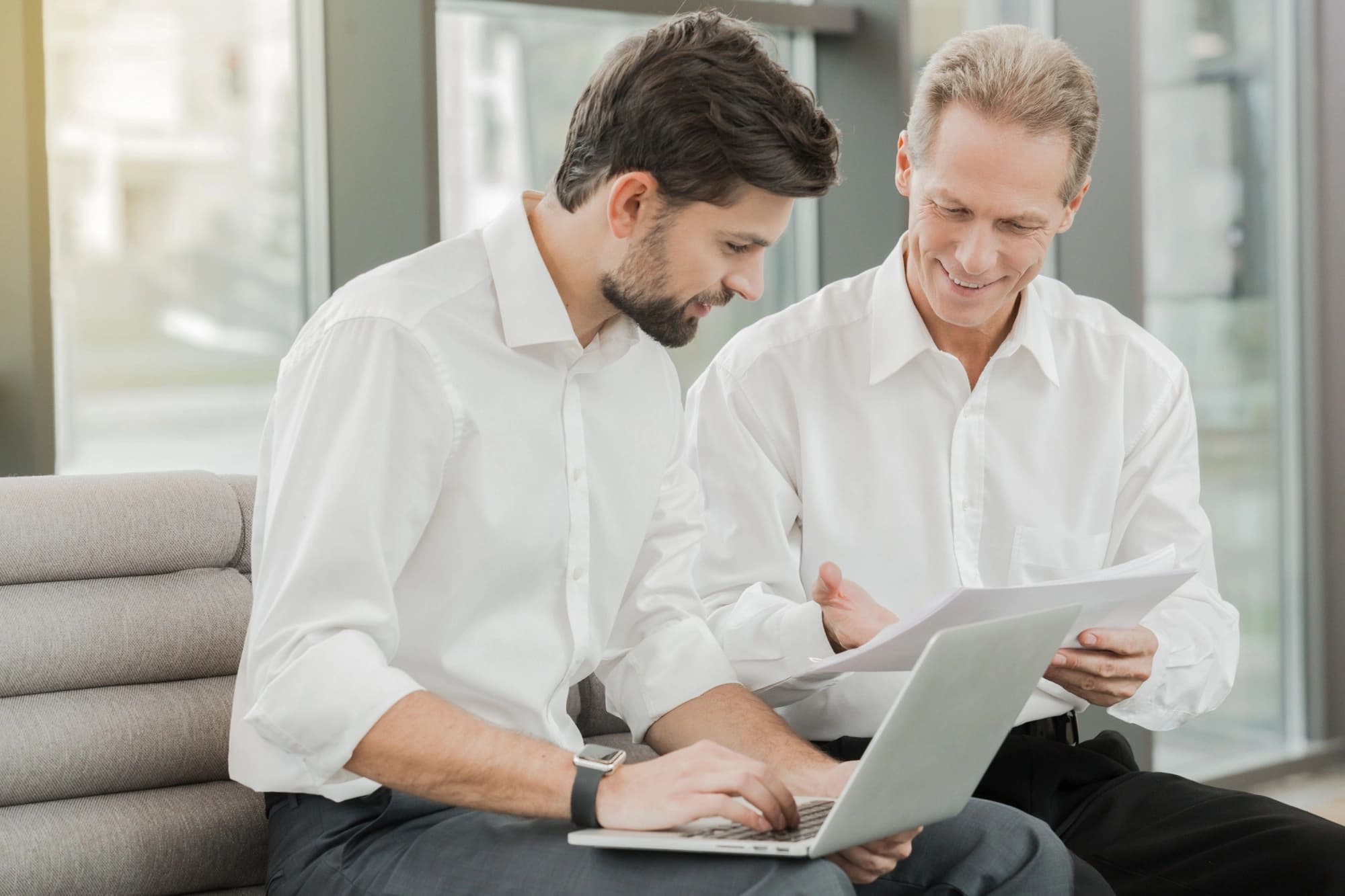 Dad and son reviewing their succession plan.