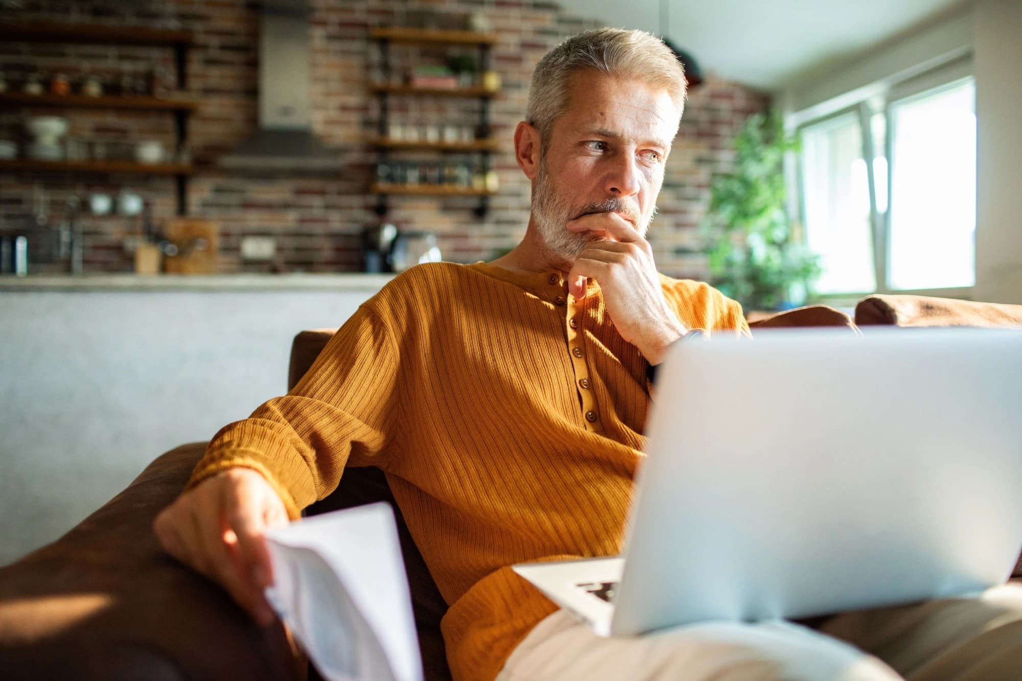a retirement-aged man with a laptop