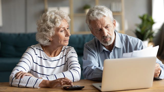 Senior couple looking at their retirement plan together