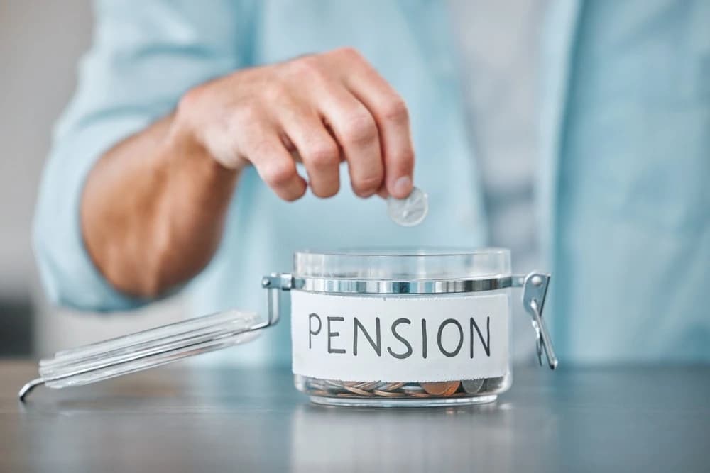 Someone contributing to a jar representing his pension plan