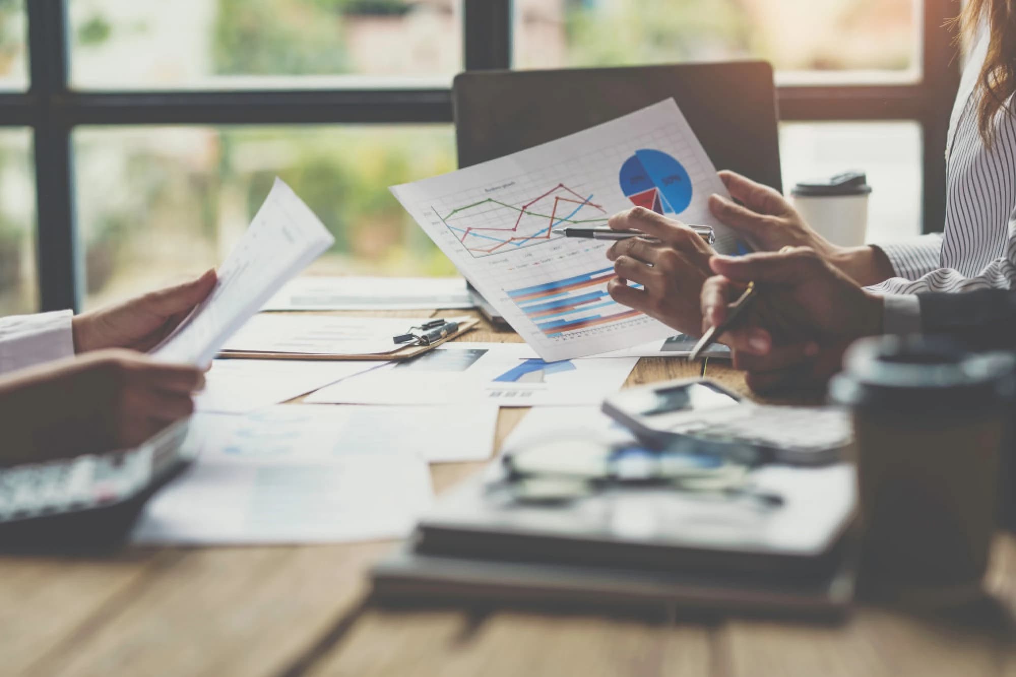 An advisor reviewing portfolio performance with clients