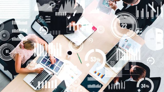 Graphic image of metrics overlaying a conference table