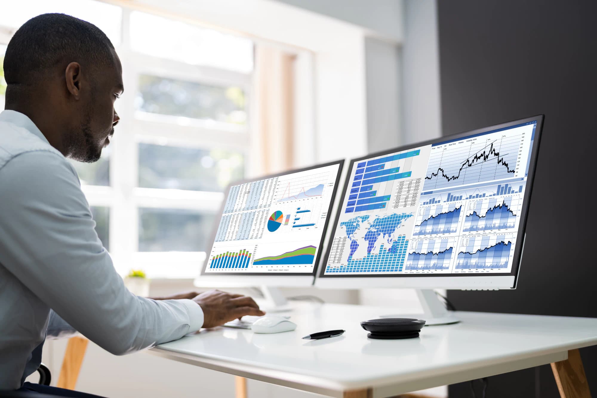 Businessman looking at economic forecasts on his computer