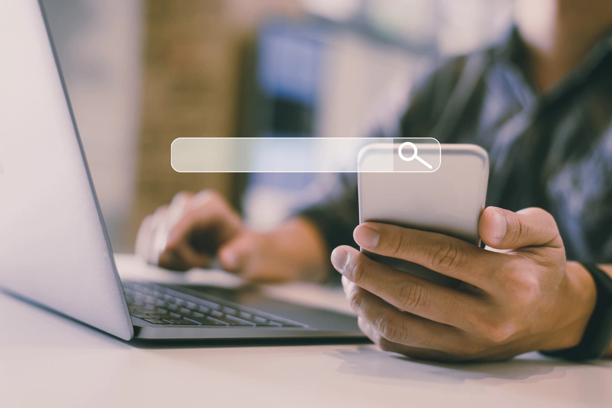 Businessman looking on his phone for a wealth management firm