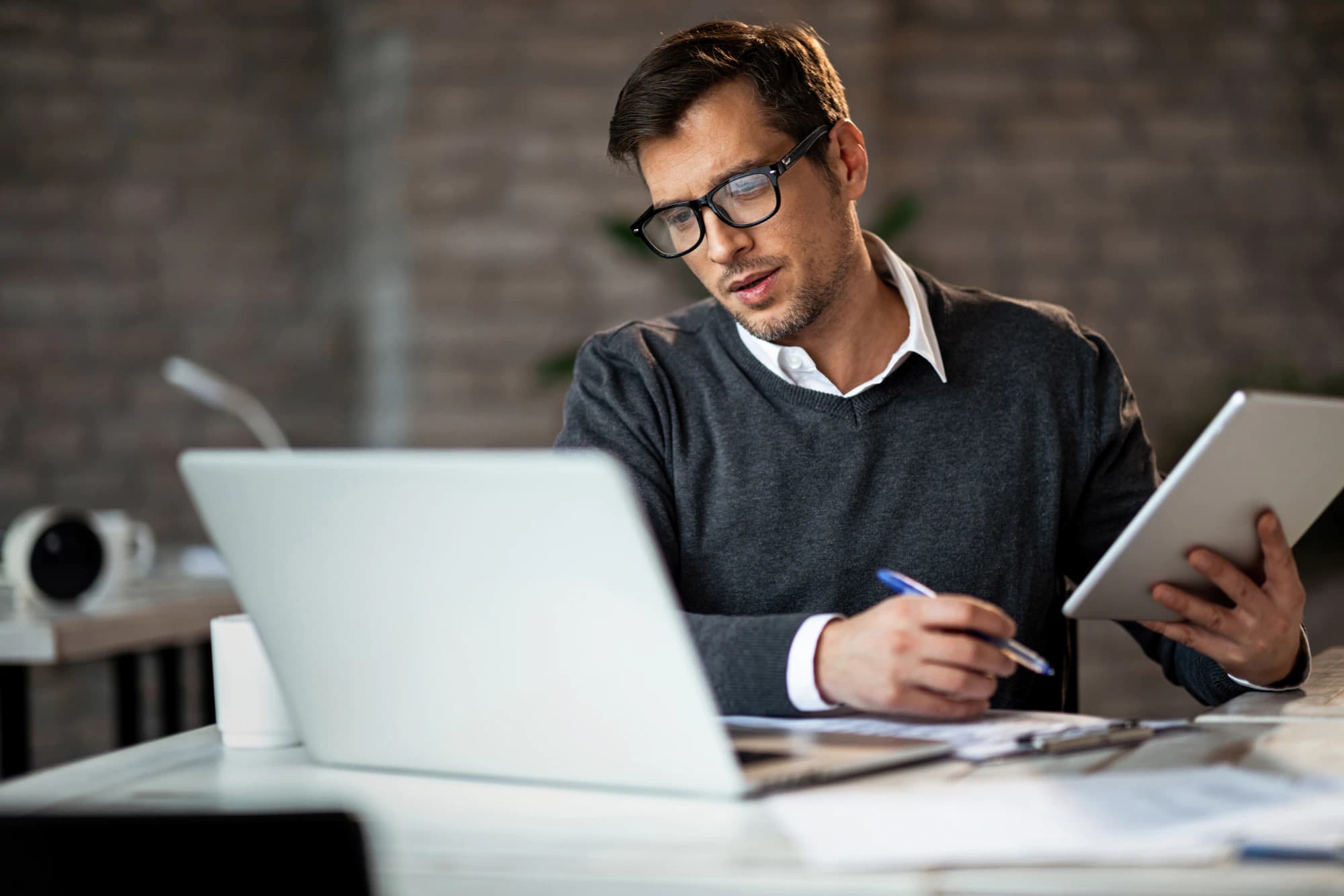 Businessman filing his taxes on his laptop