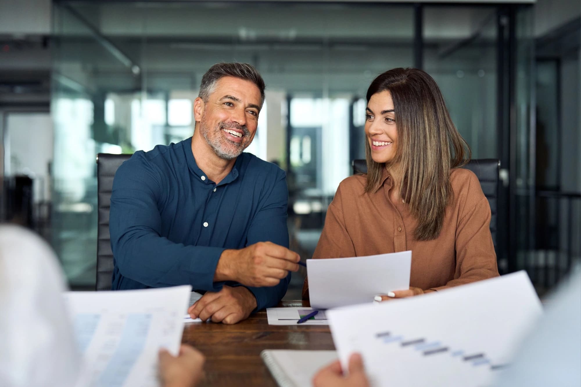 Latina couple meeting with a financial advisor in Houston