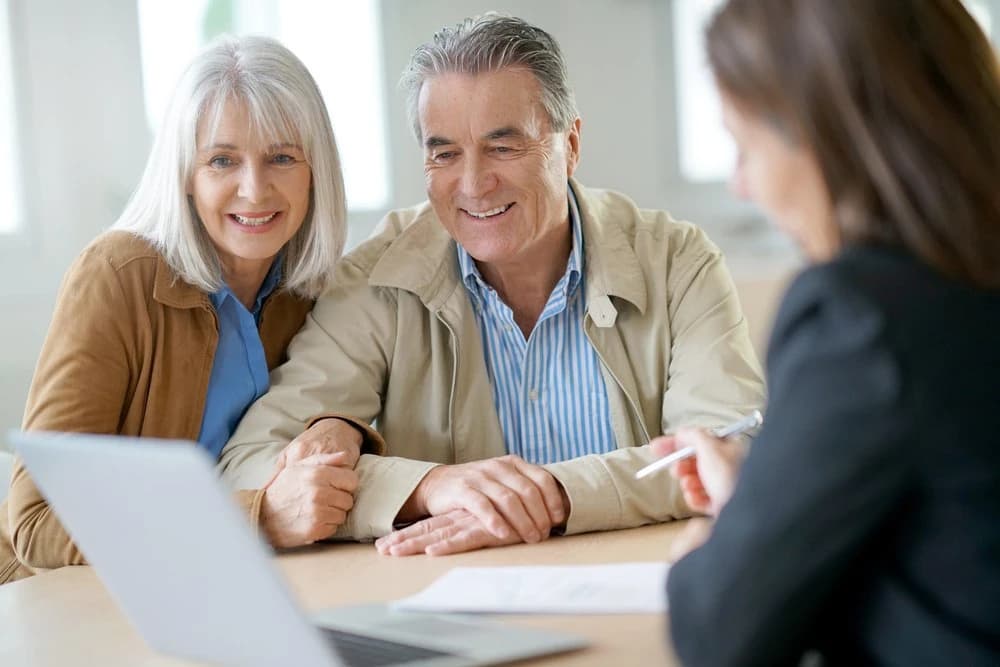 Senior couple consulting with a financial planner