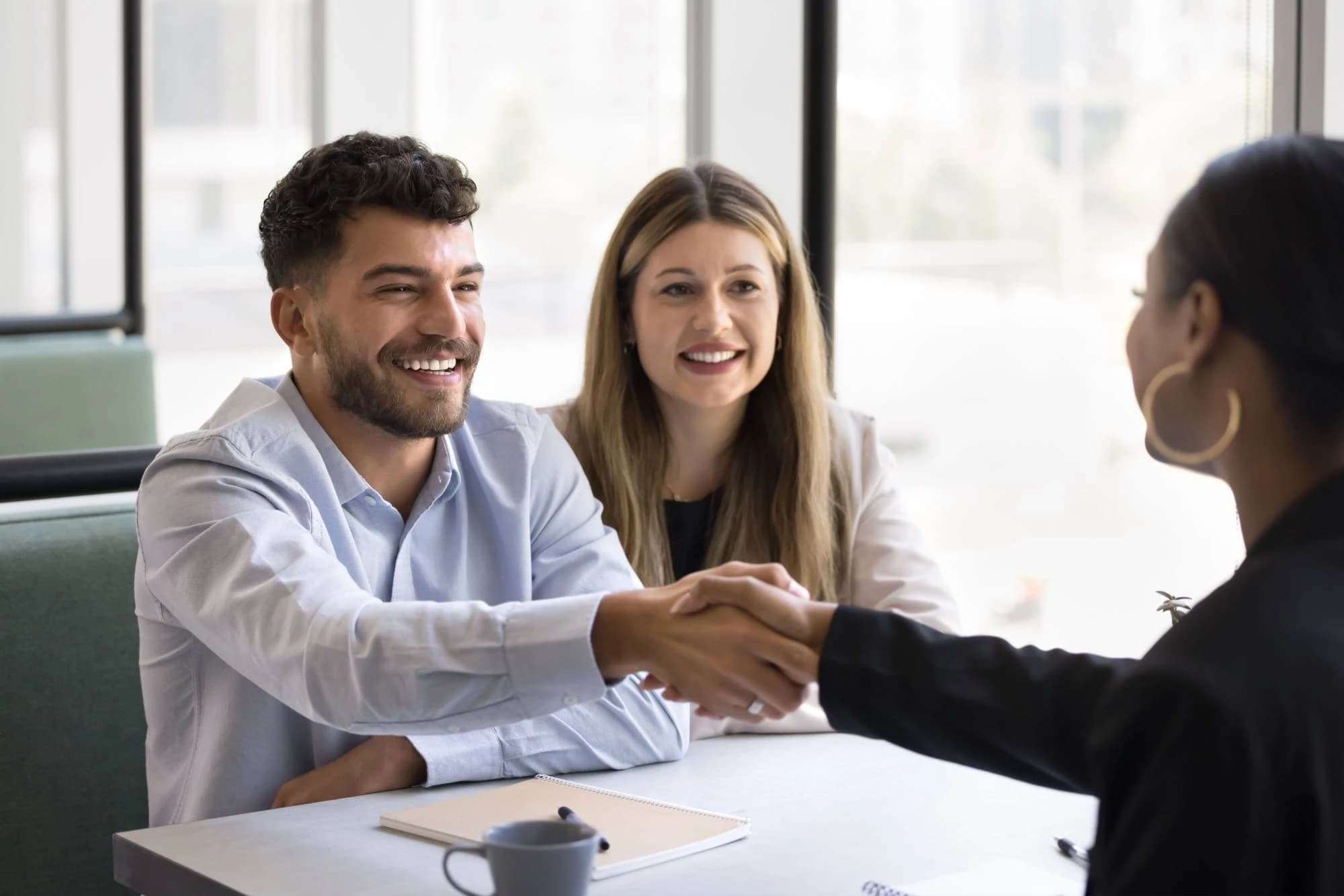 A high-net-worth couple meeting with their financial advisor