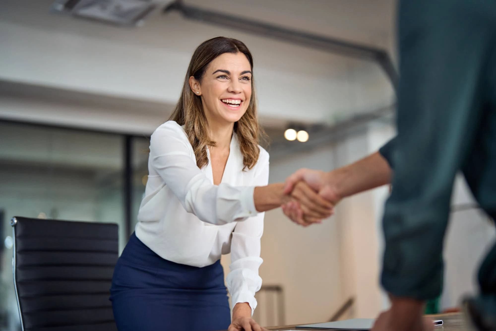 an outsourced CIO shaking hands with a businessman