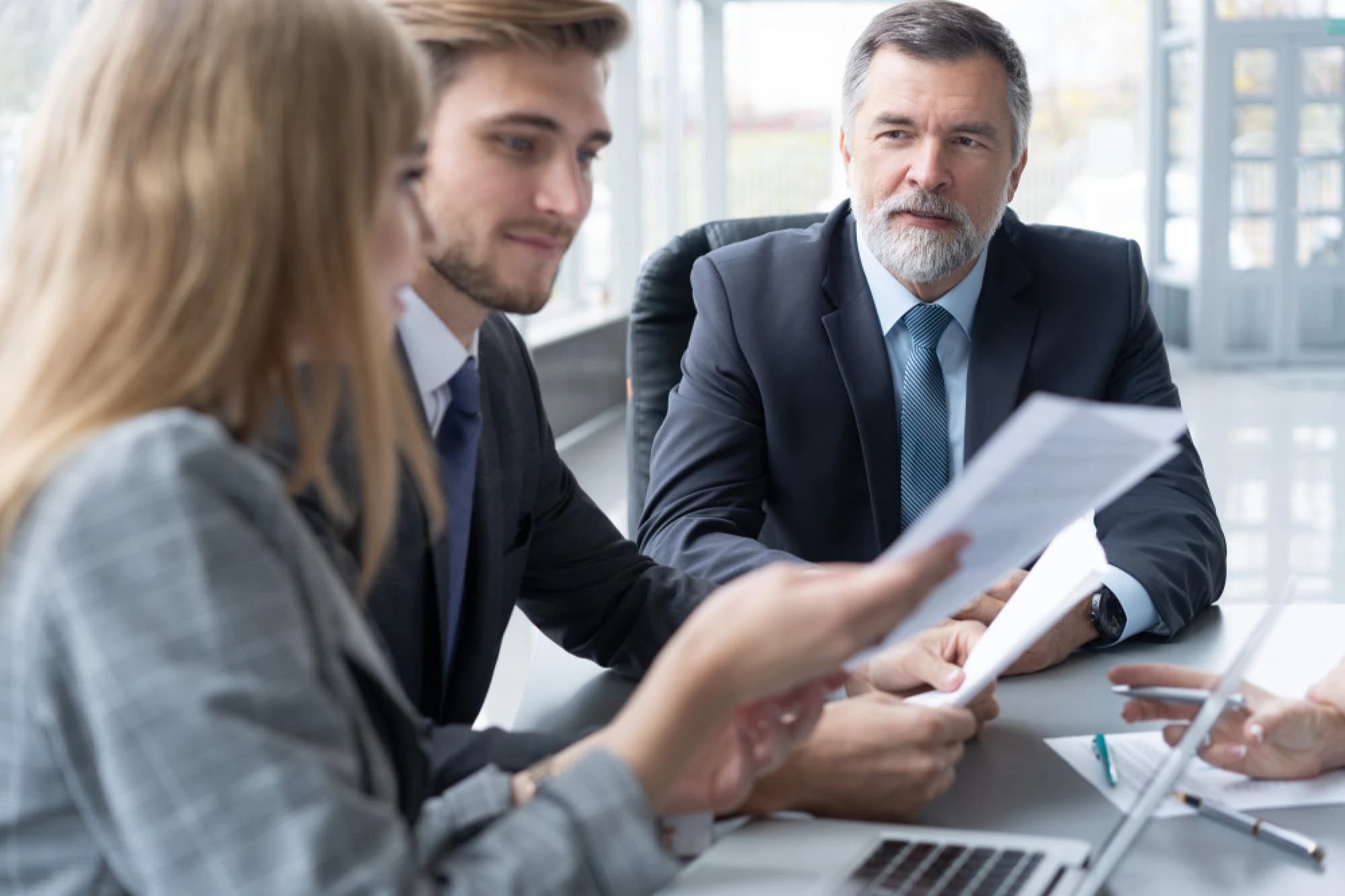 Members of an ultra-high-net-worth family reviewing their estate plan