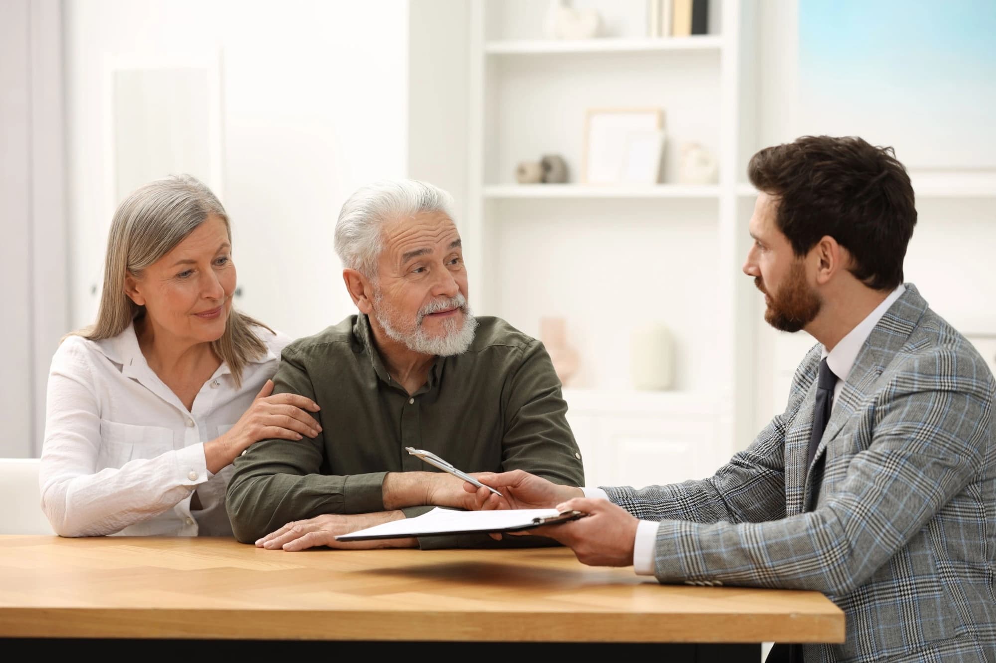 an estate planning advisor meeting with an elderly couple