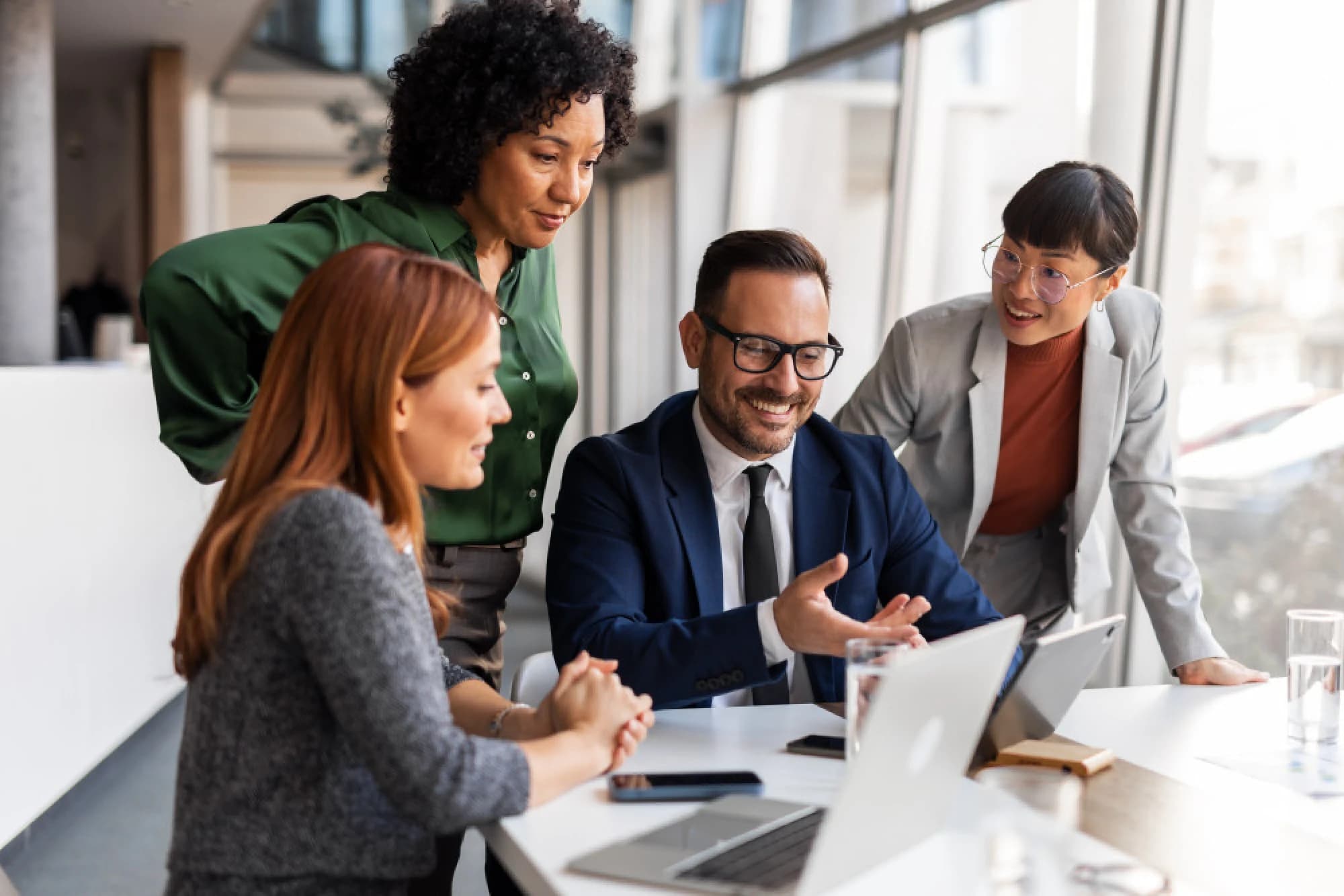 A financial advisor meeting with his entrepreneur clients