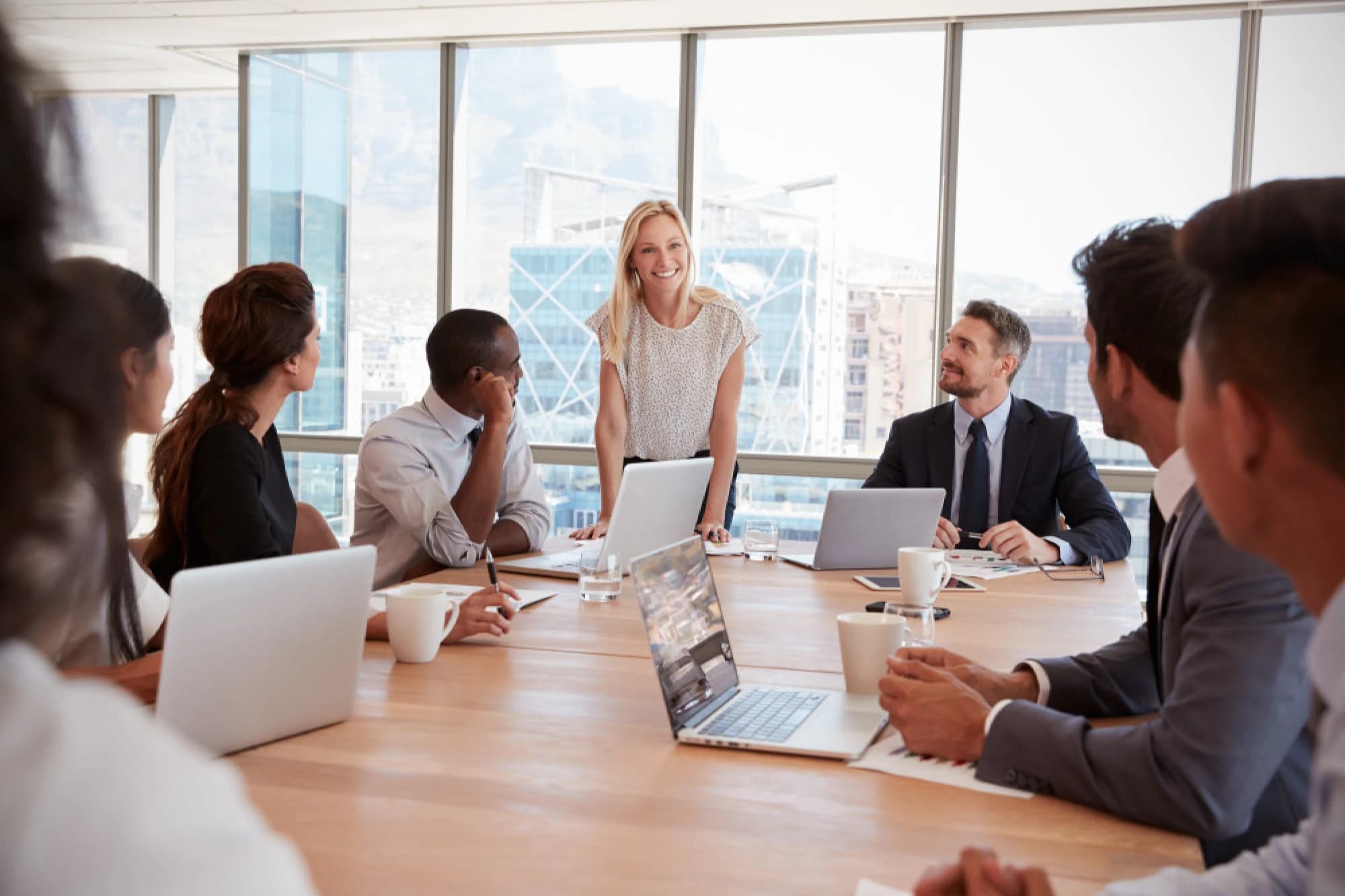 Members of an investment committee seated around a table