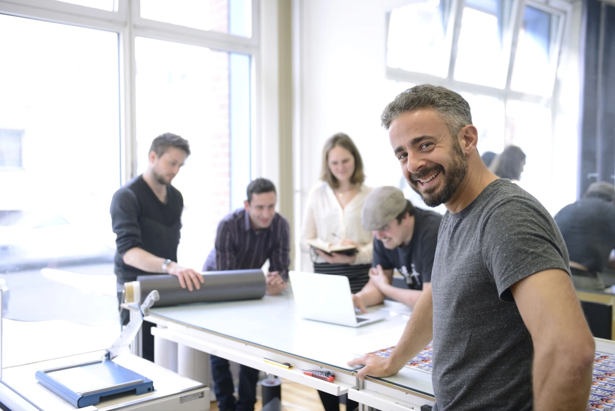 Business owner leading a meeting about how to save for retirement