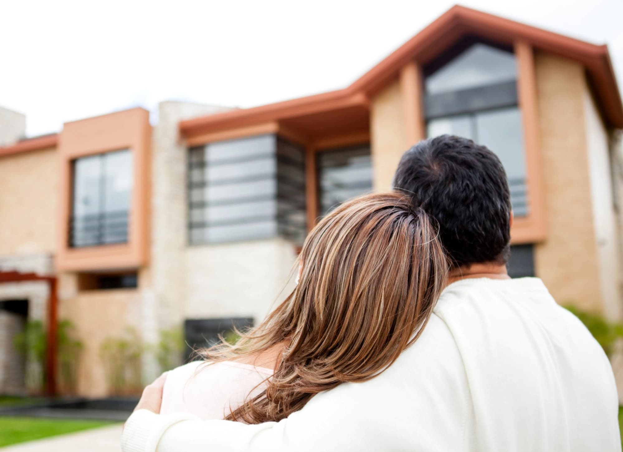 married couple looking at their new property