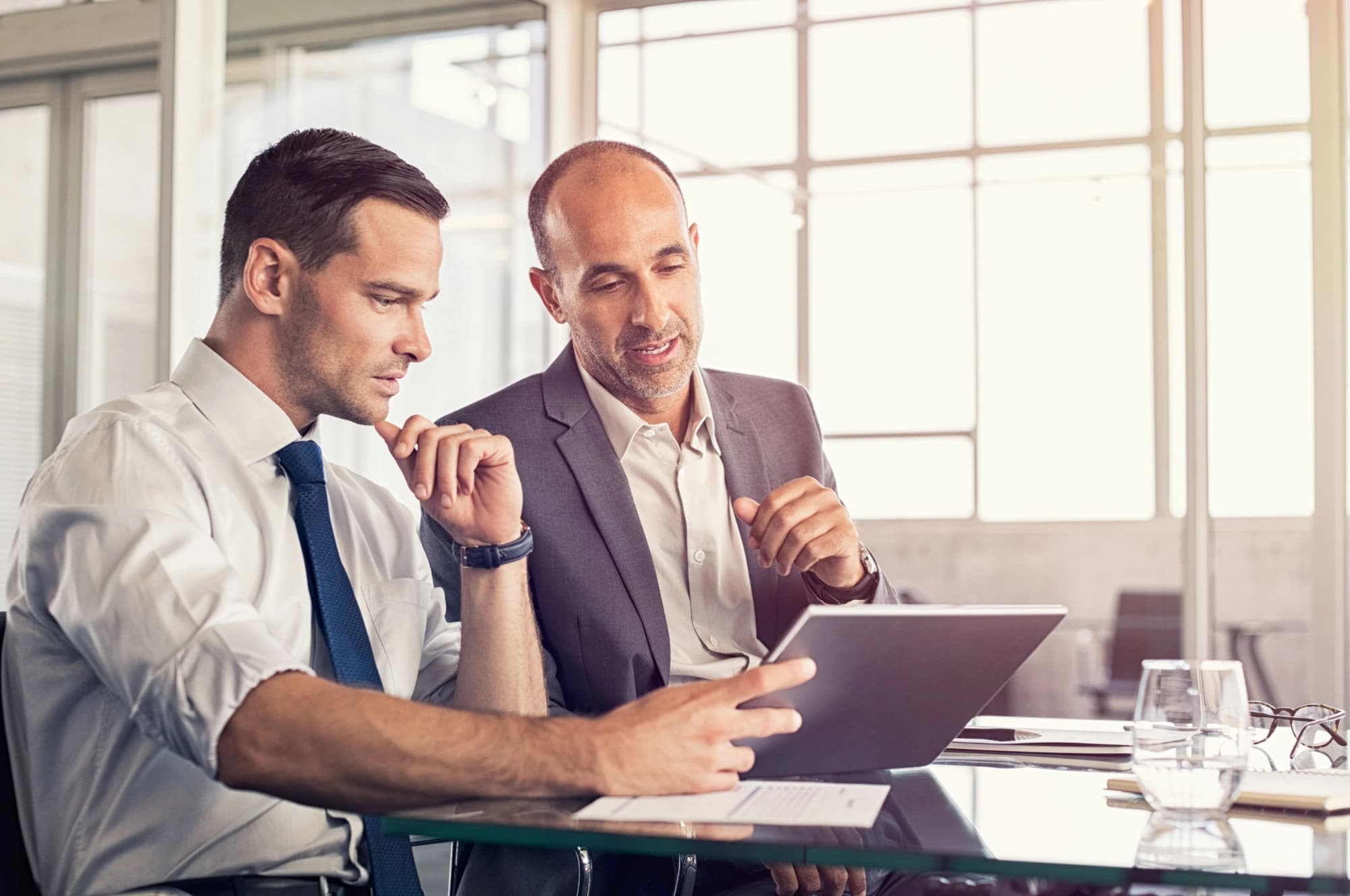 Businessman looking at their portfolio with a wealth manager in Austin, Texas