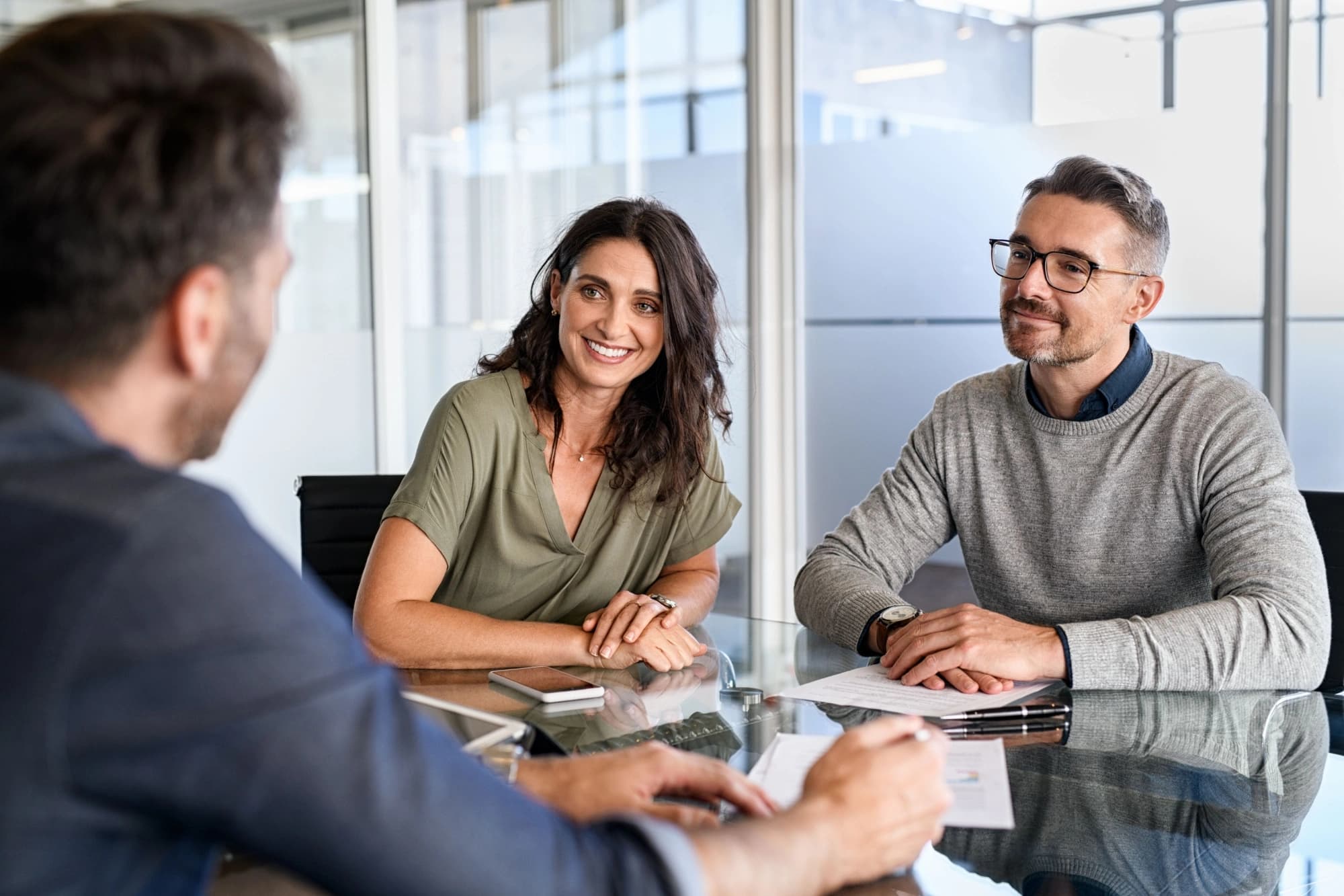 Husband and wife meeting with a financial advisor