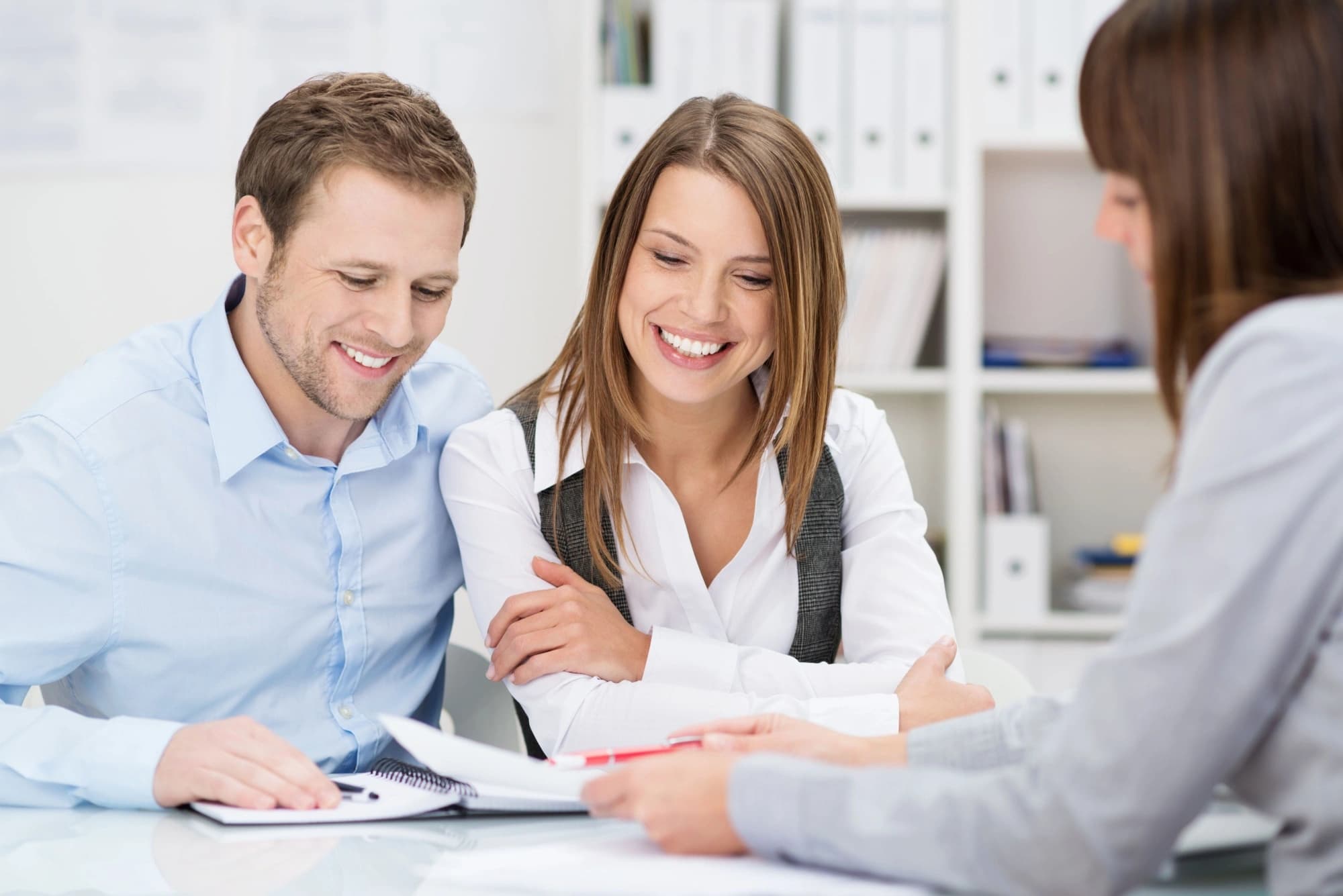 Young couple meeting with their wealth manager in Texas
