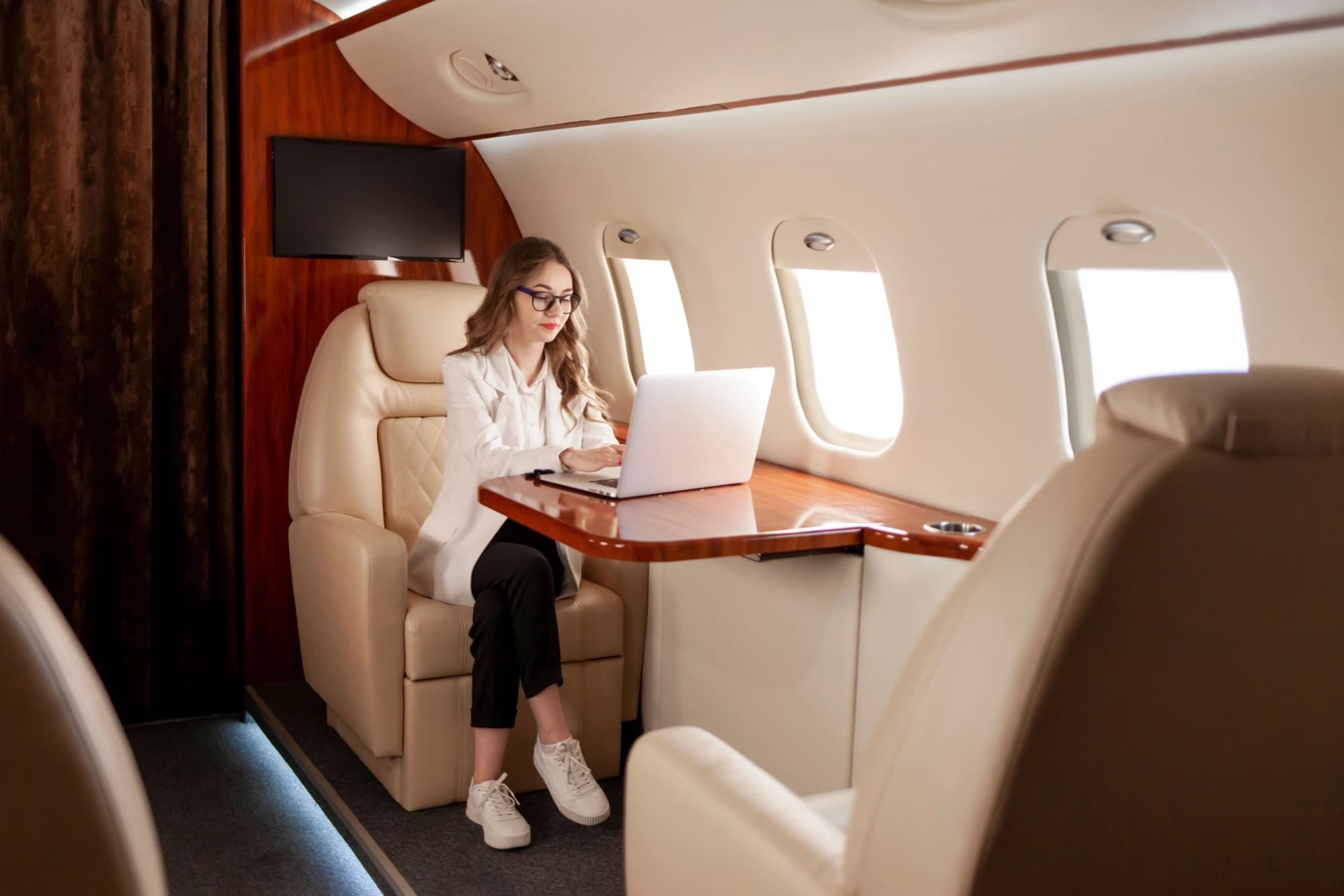 Businesswoman working on a private jet