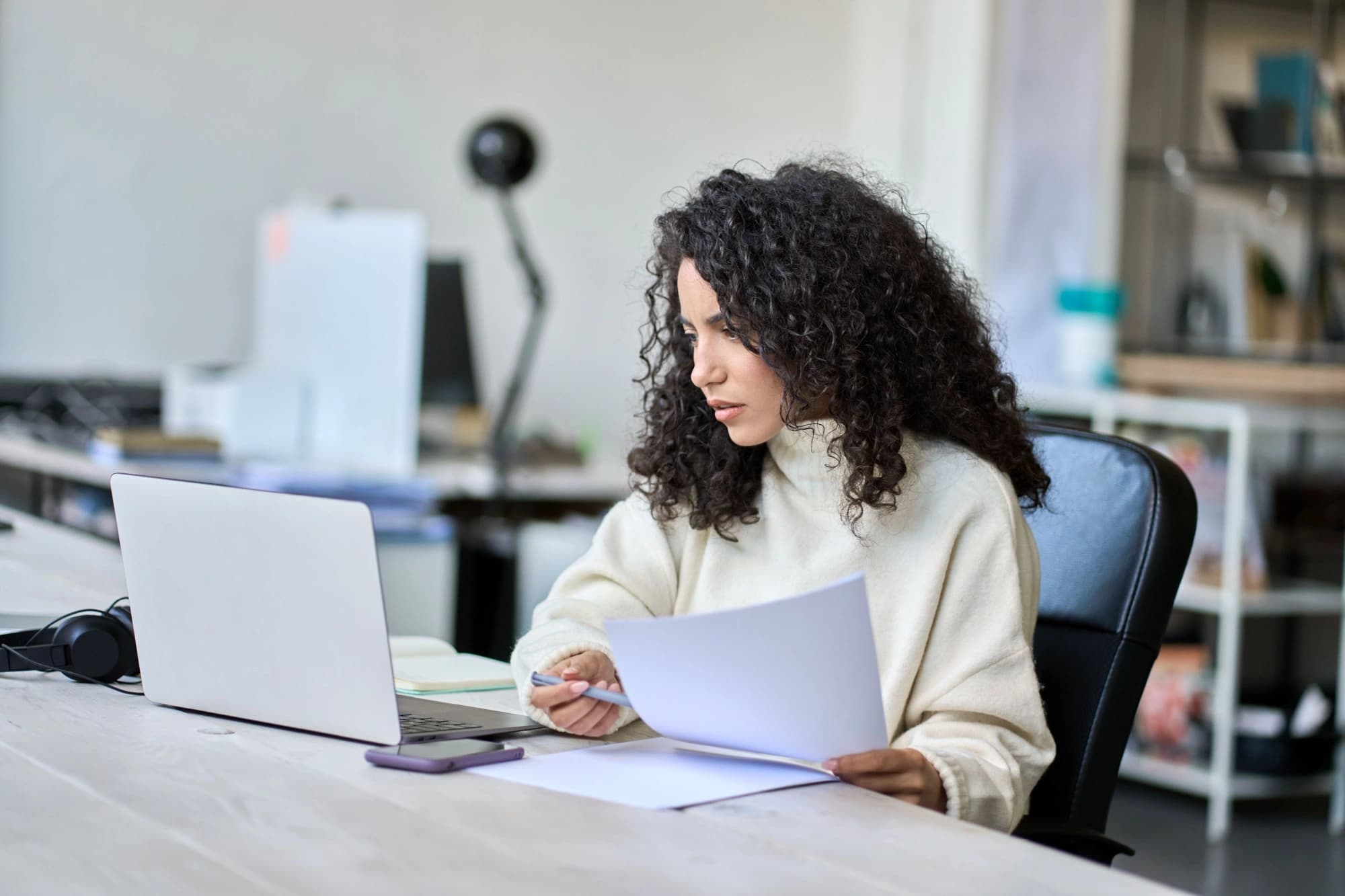 Latina woman reviewing her financial plans