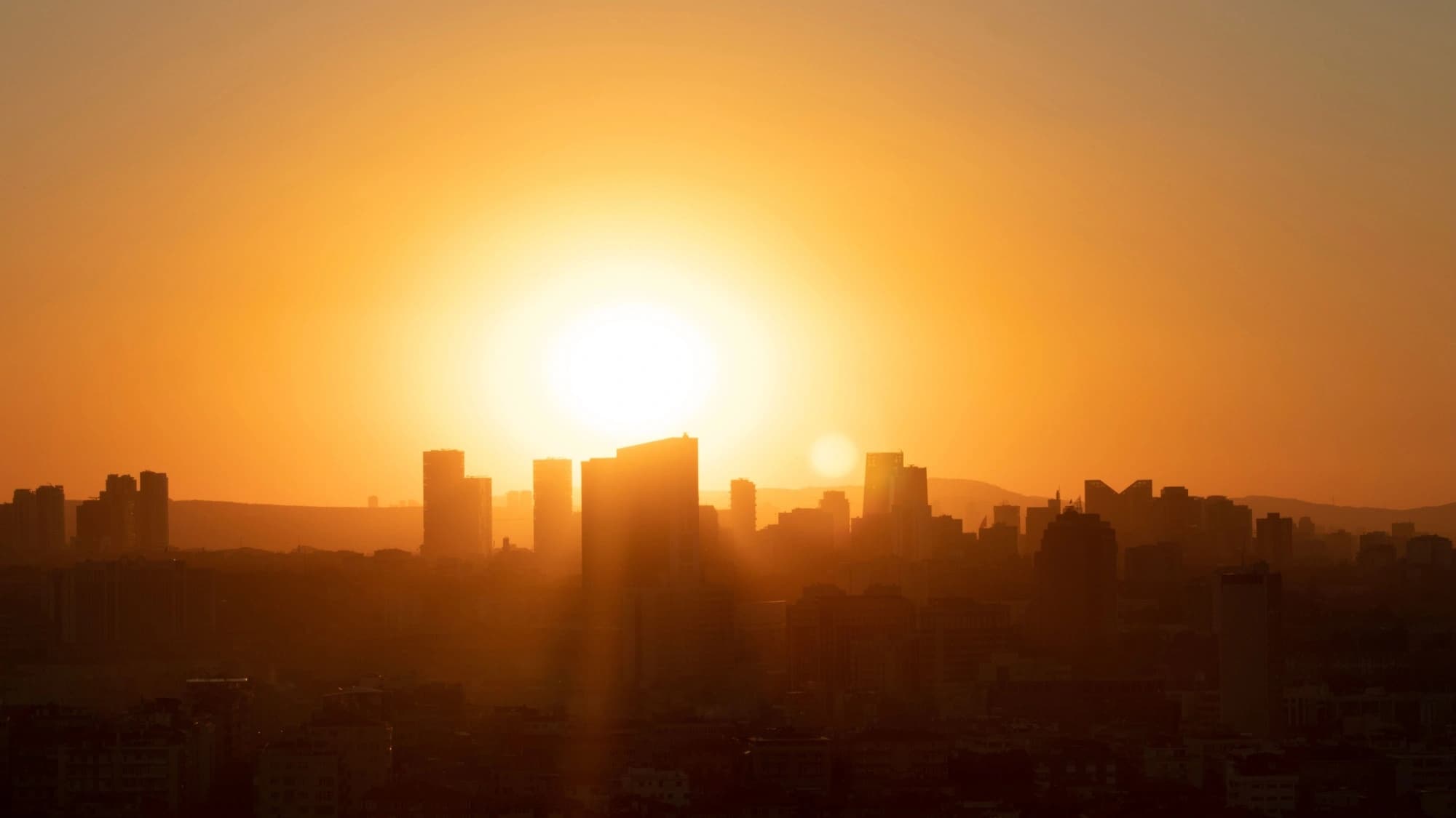 Cityscape with the sun setting in the background