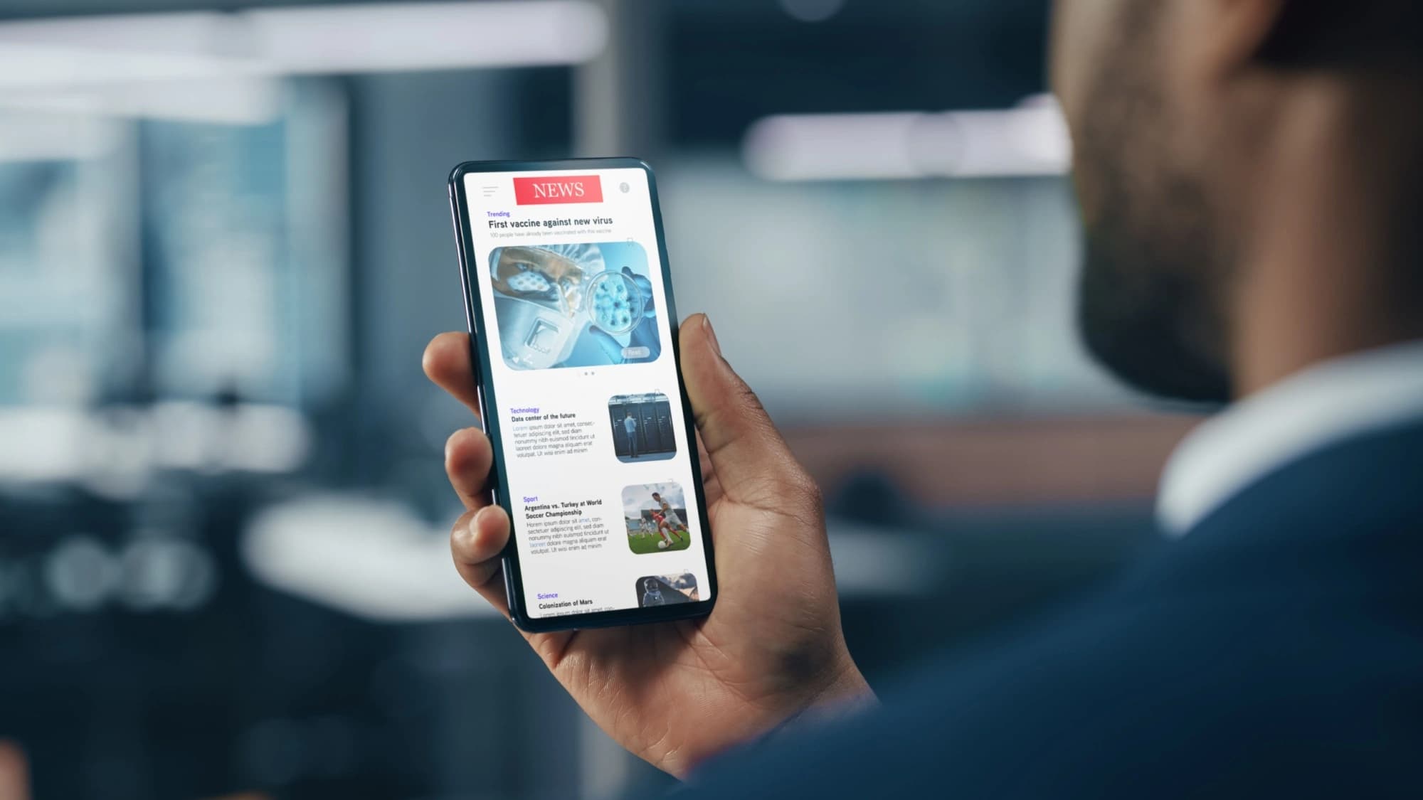 Businessman reading the news on his phone