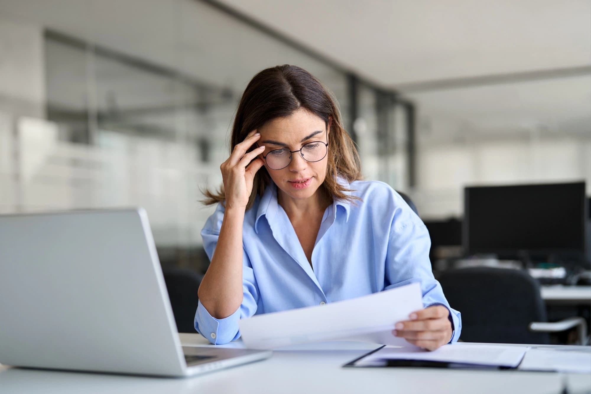Businesswoman reevaluating her portfolio investment entity structure