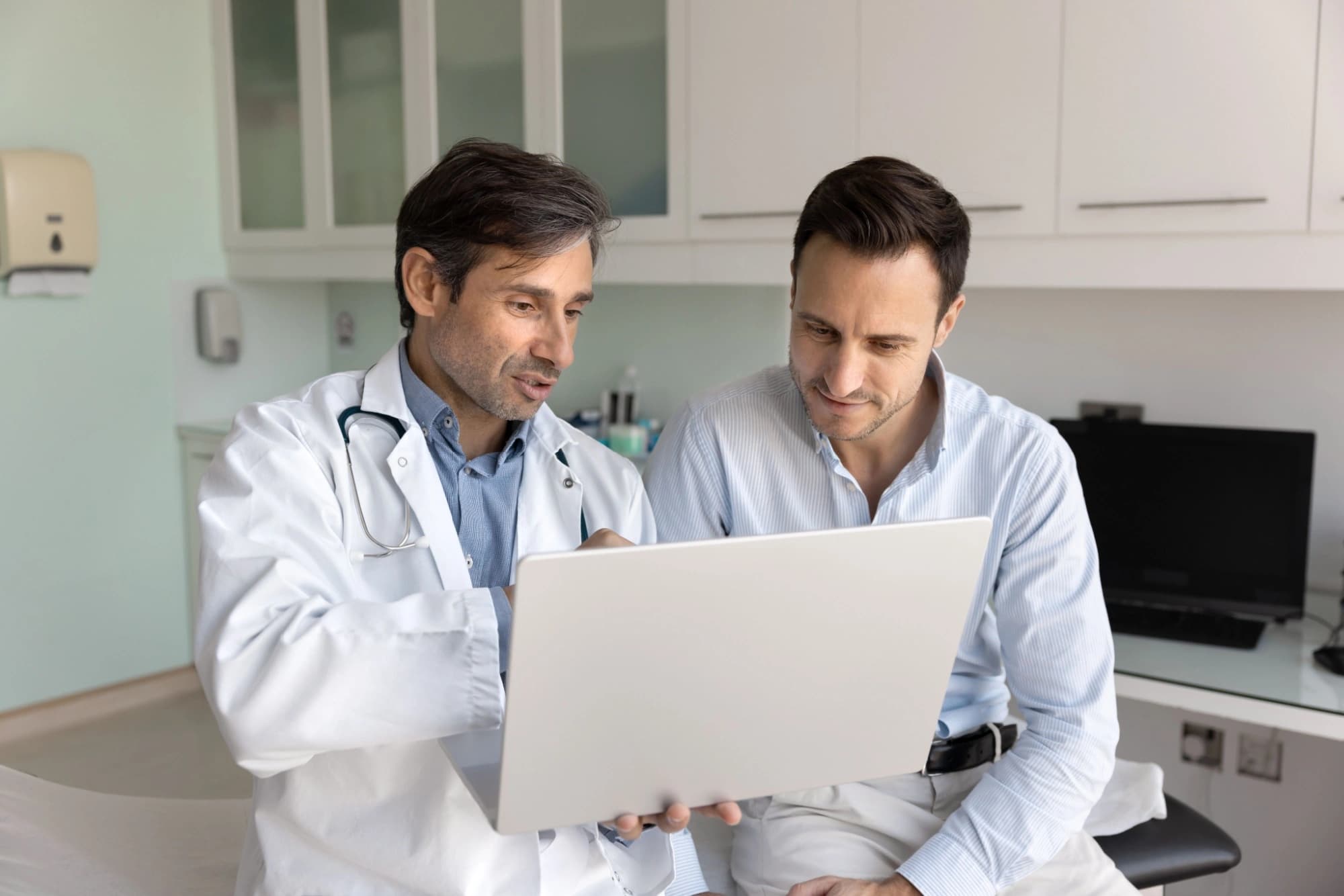 Doctor going over his patient's future medical needs before retirement