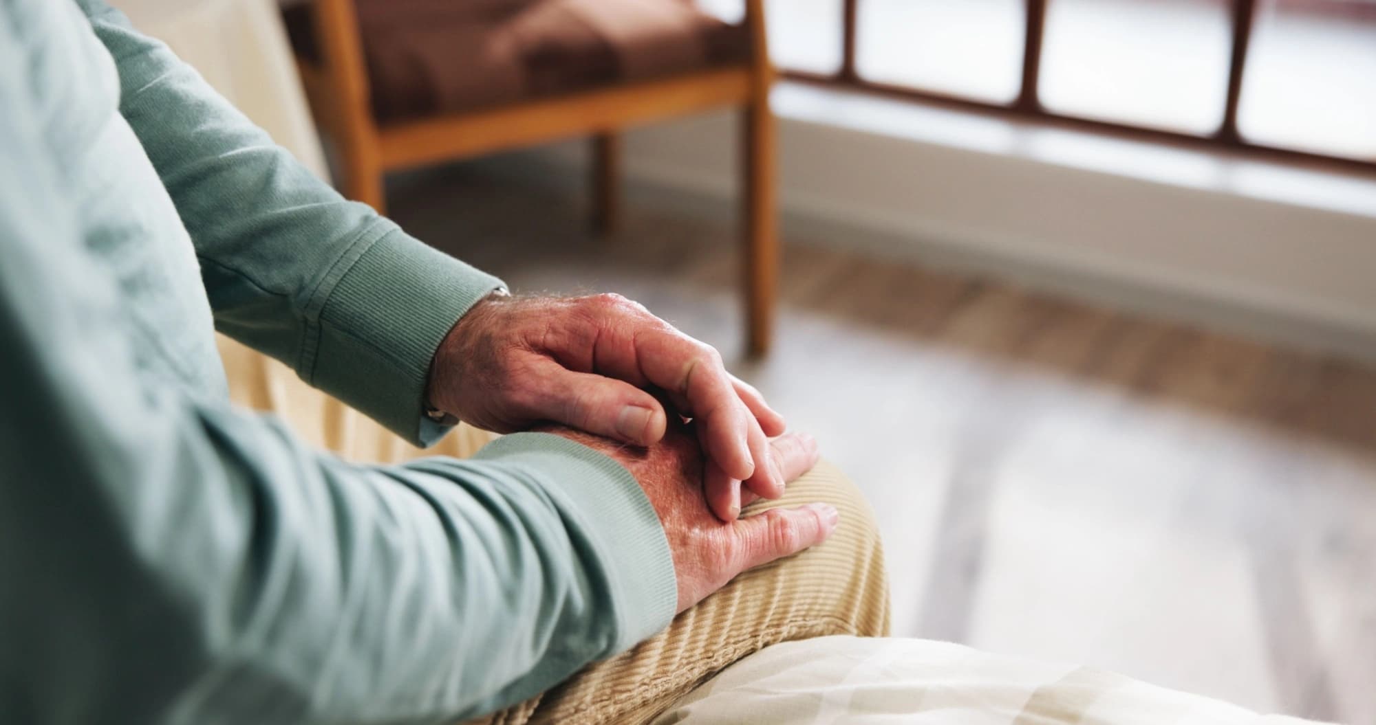 a pair of hands belonging to an elderly person
