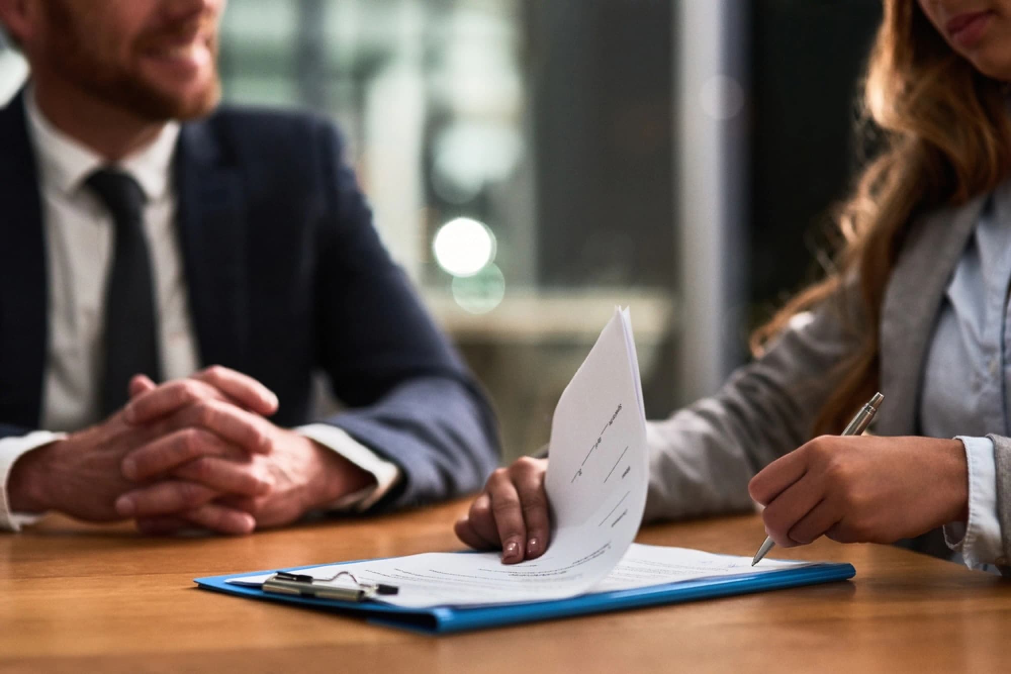 A wealth advisor reviewing a client’s business insurance contract