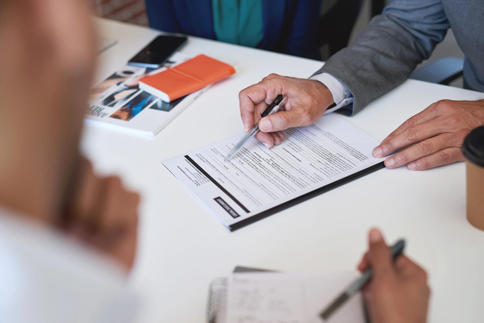 An advisor reviewing legal forms with a client