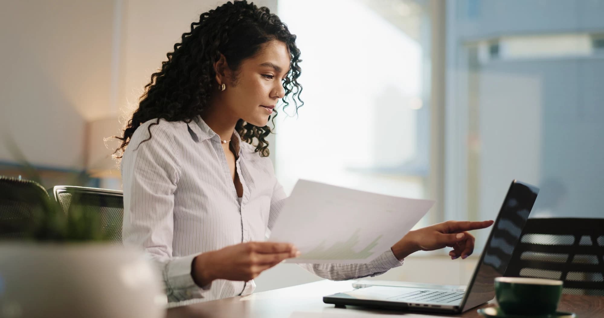 Businesswoman researching the STR loophole on her laptop